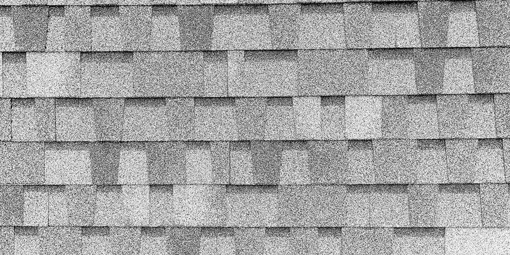 close up of grey roof asphalt shingles