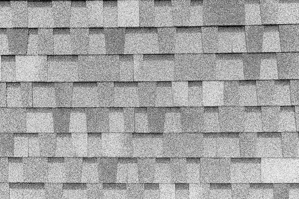 close up of grey roof asphalt shingles