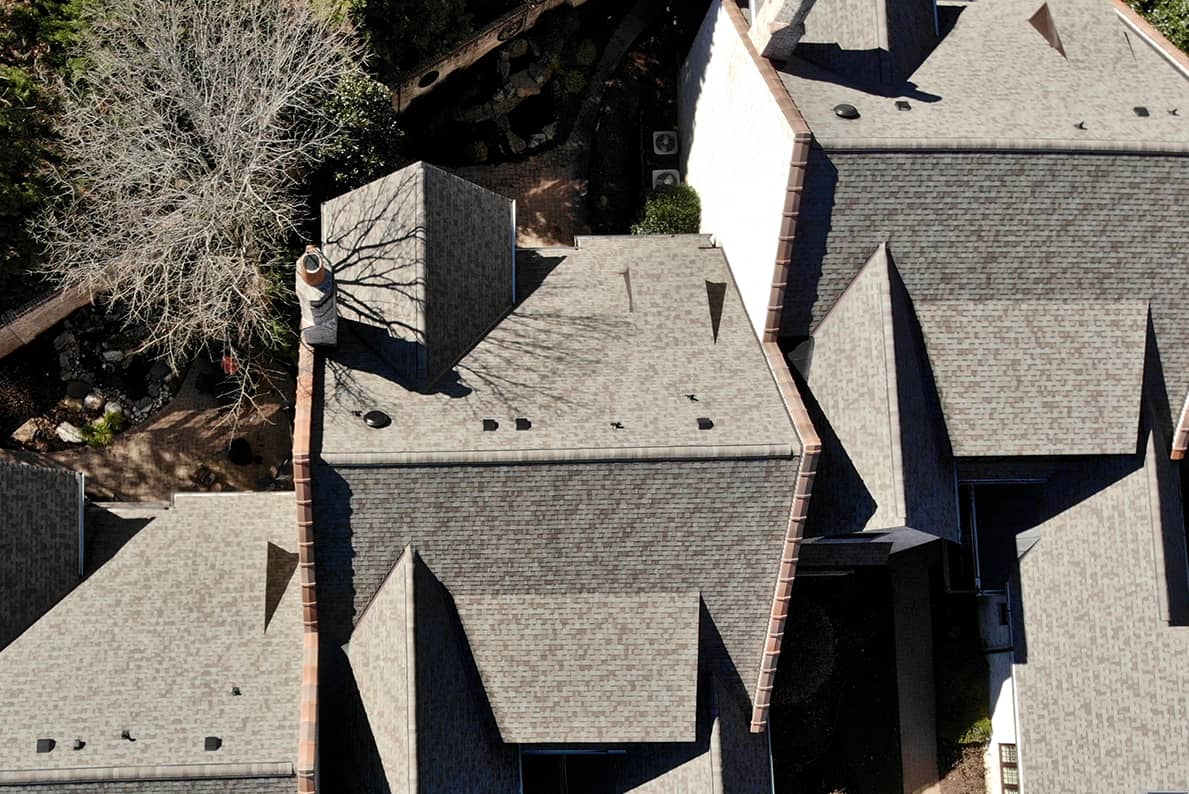 Multi-family home roof inspection from aerial view