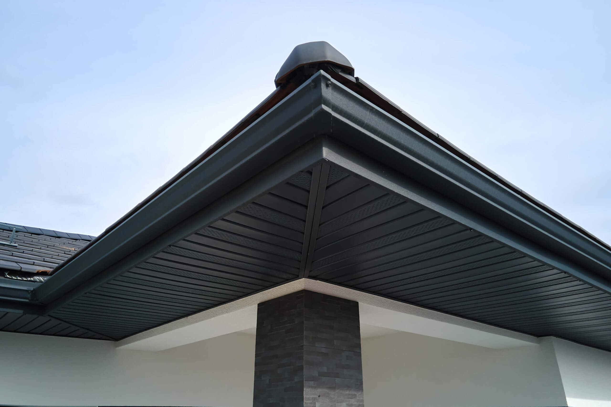 black gutter system installed on a home