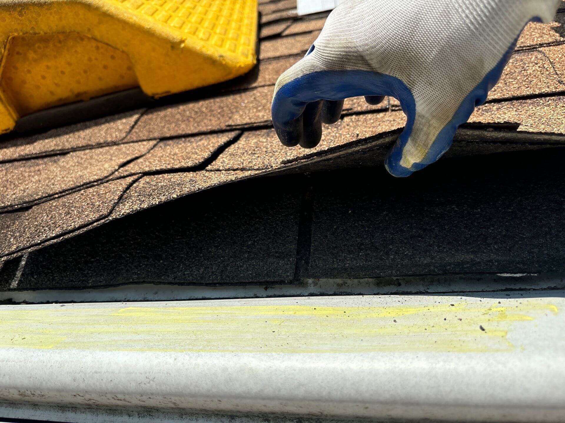 storm damage being checked during a roof inspection