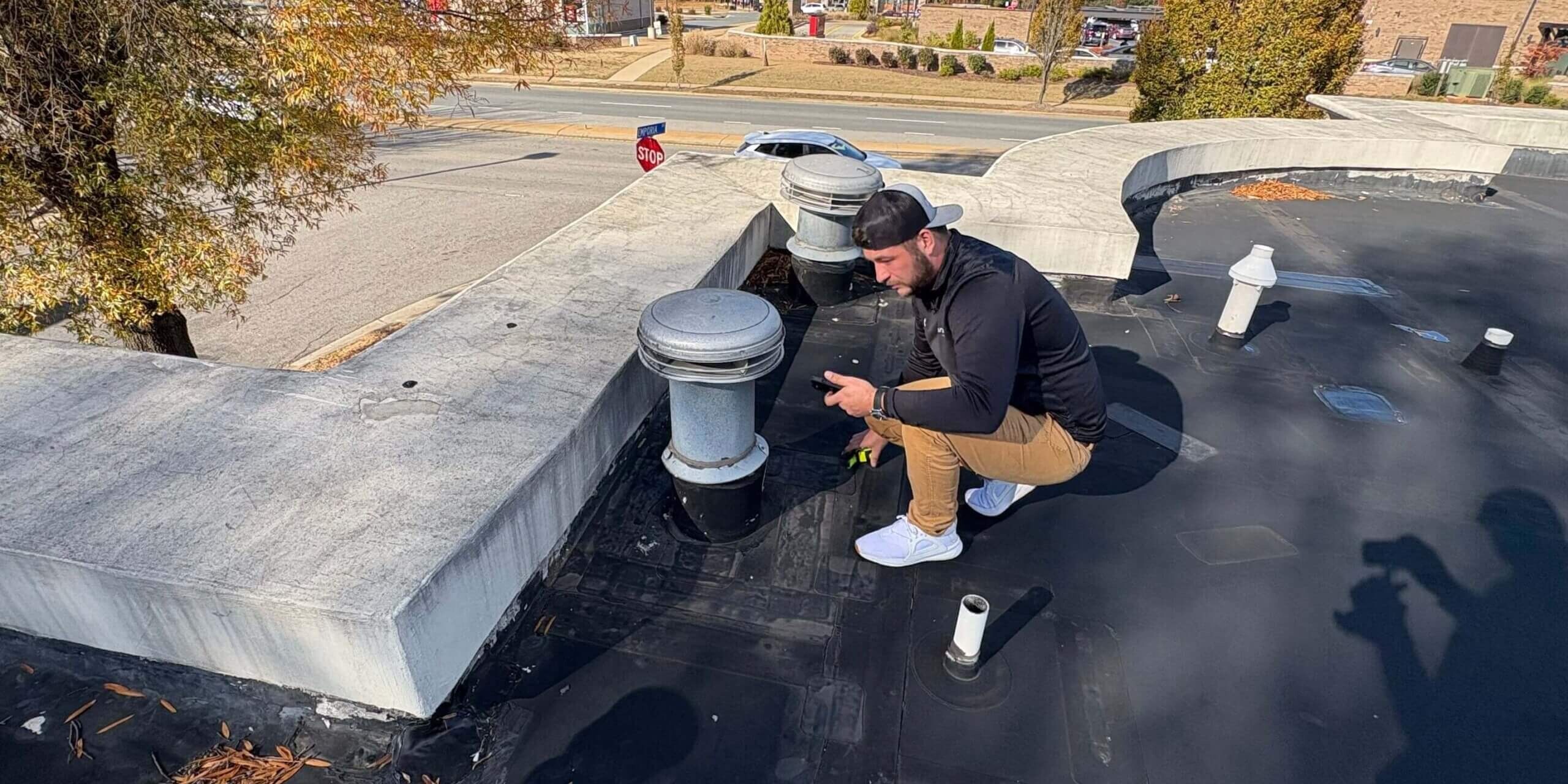 A horizon team member inspecting a commercial roof