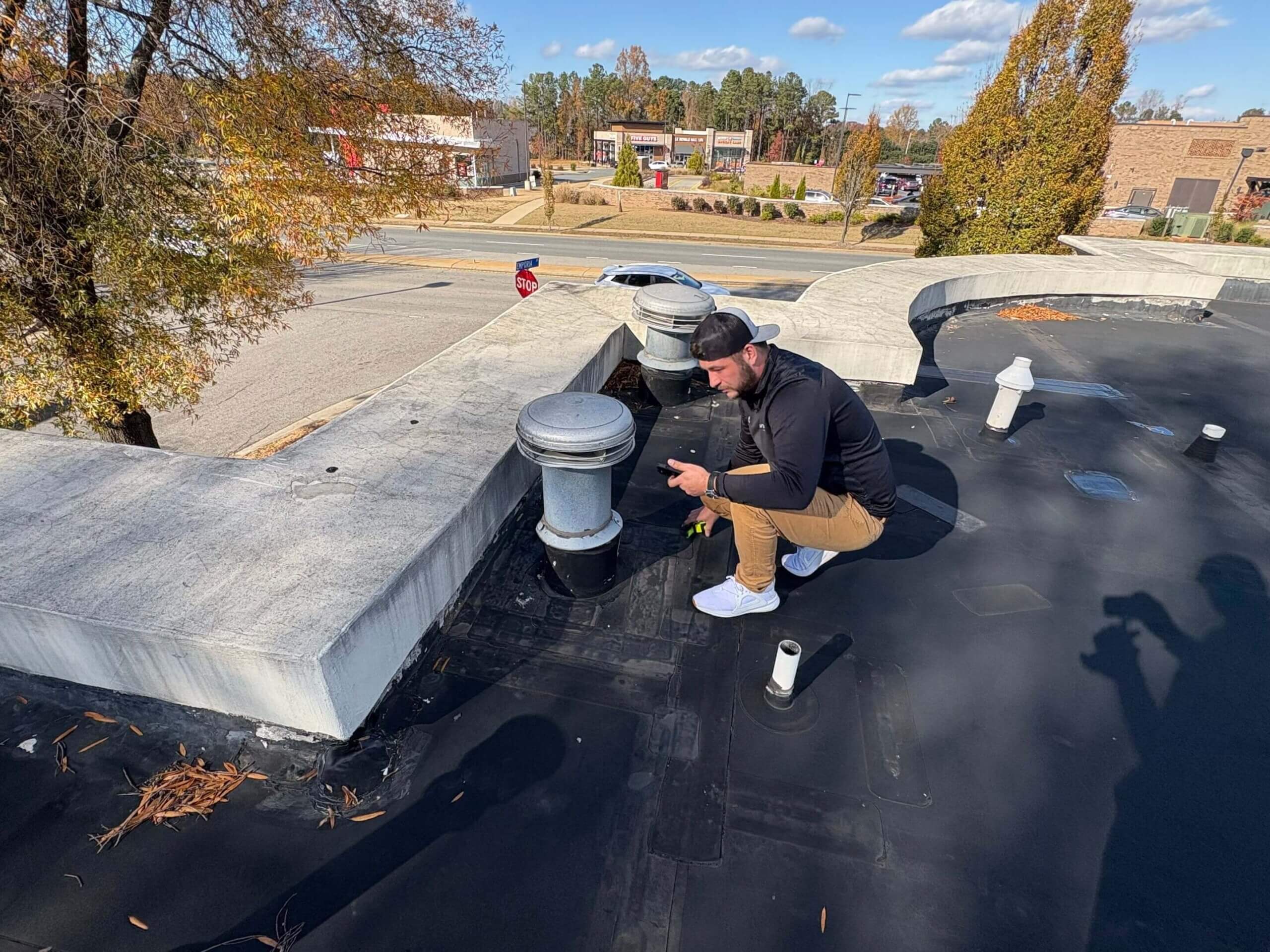 A horizon team member inspecting a commercial roof