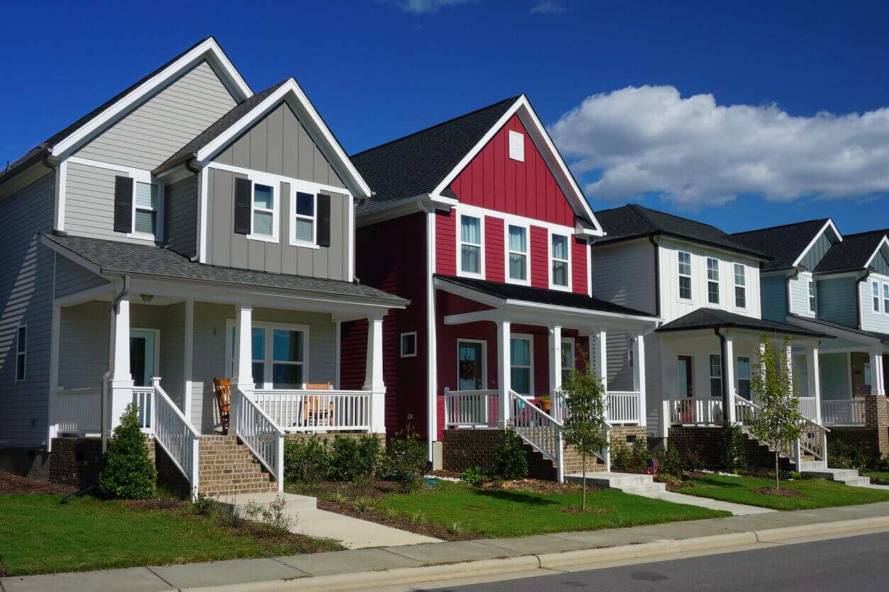 A row of colorful townhomes with new roofs