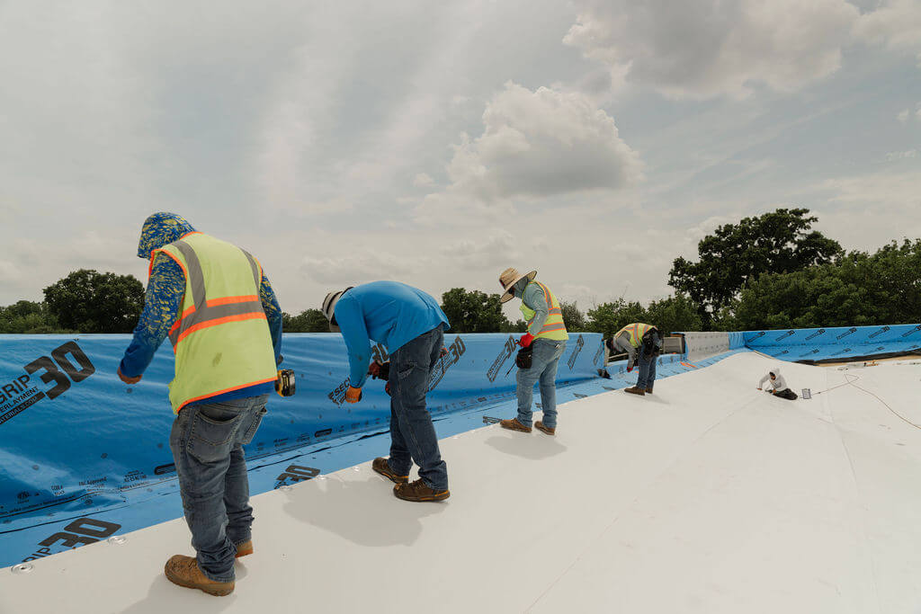Horizon roofing crew working on a commercial roof