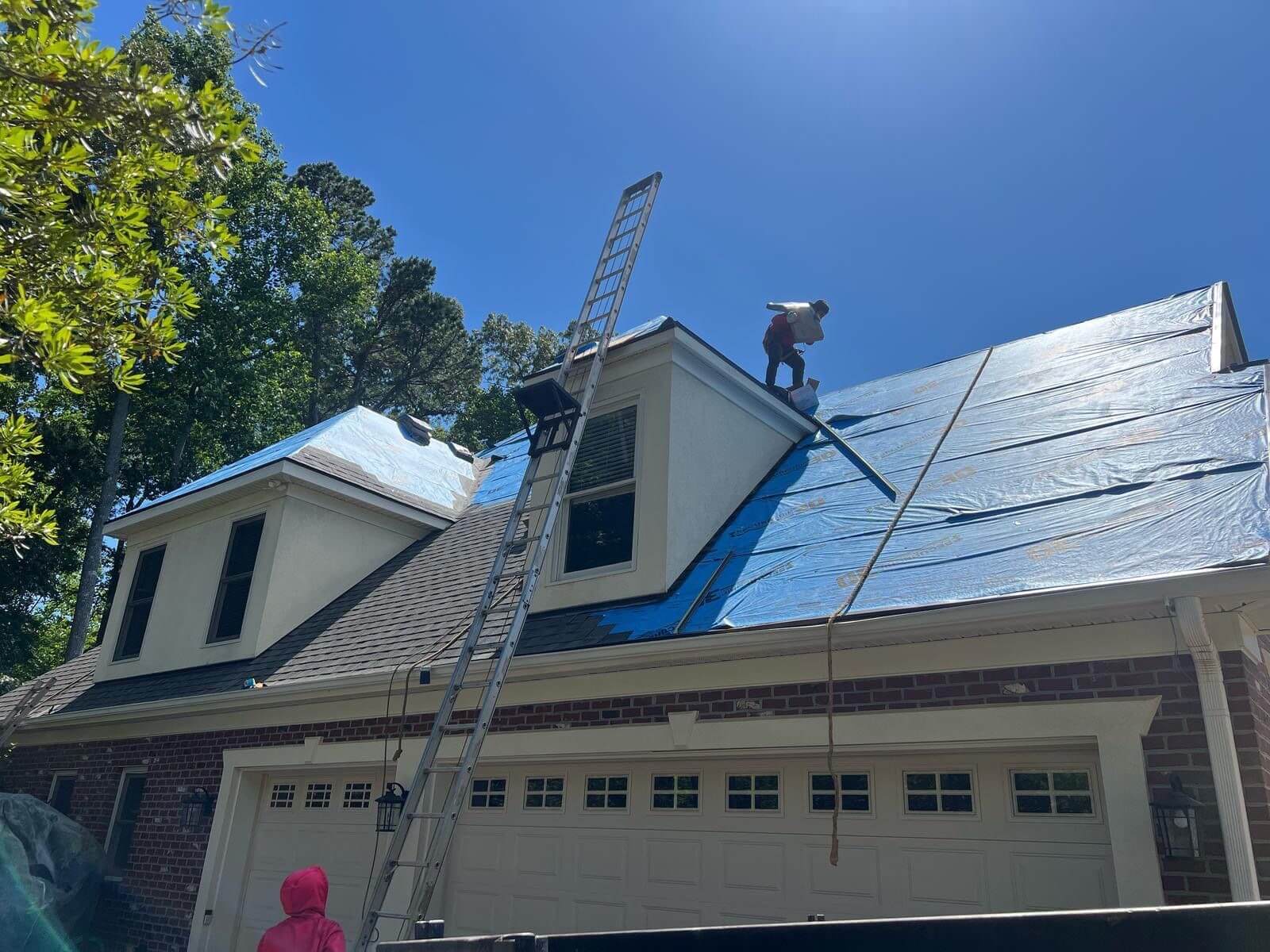 a roof replacement being completed on a home in the Charlotte area